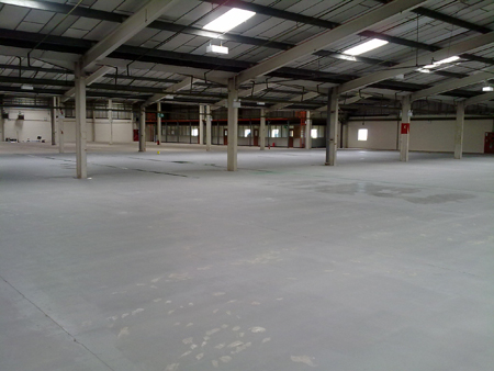 The water-based seal coat was applied by roller, this high-lighted small repairs in the floor which were filled with a suitable repair compound